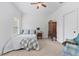 Cozy bedroom with a comfortable bed, antique chest, and ceiling fan at 1550 Bluewater Run, Chuluota, FL 32766
