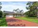 Charming two-story home with a welcoming front porch and beautifully manicured lawn at 1550 Bluewater Run, Chuluota, FL 32766