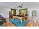 Entertaining game room with a pool table, bar, and ample seating at 1550 Bluewater Run, Chuluota, FL 32766
