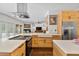 Well-equipped kitchen with white countertops, modern appliances, and ample cabinet space at 1550 Bluewater Run, Chuluota, FL 32766