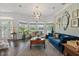 Comfortable living room with natural light, plush seating, and stylish decor at 1550 Bluewater Run, Chuluota, FL 32766