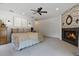 Elegant main bedroom with a fireplace and serene ambiance at 1550 Bluewater Run, Chuluota, FL 32766
