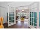 View of office featuring natural light, custom bookshelves, and stylish decor at 1550 Bluewater Run, Chuluota, FL 32766