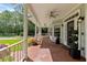 Inviting outdoor porch with brick flooring, offering a cozy space to relax and enjoy the scenery at 1550 Bluewater Run, Chuluota, FL 32766
