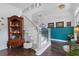 Elegant staircase with white railings, and decorative details at 1550 Bluewater Run, Chuluota, FL 32766