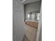 Bathroom boasts double sinks, tile floor, a large mirror, and a toilet at 1710 Canoe Creek Rd, Oviedo, FL 32766