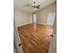 Large bright bedroom with wood floors and lots of natural light from multiple windows at 1710 Canoe Creek Rd, Oviedo, FL 32766