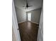 This bedroom features a ceiling fan, one window and sleek wood-look floors at 1710 Canoe Creek Rd, Oviedo, FL 32766