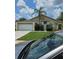Charming single-story home with a well-manicured lawn and a mature palm tree at 1710 Canoe Creek Rd, Oviedo, FL 32766