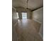 Spacious living room with tile flooring, leading to a screened-in pool area at 1710 Canoe Creek Rd, Oviedo, FL 32766