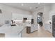 Bright kitchen with white cabinets, a kitchen island, and stainless steel appliances at 2046 Westover Reserve Blvd, Windermere, FL 34786