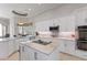 Modern kitchen featuring granite countertops, white cabinetry and stainless steel appliances at 2046 Westover Reserve Blvd, Windermere, FL 34786