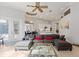Spacious living room featuring a large couch and view into the kitchen at 2046 Westover Reserve Blvd, Windermere, FL 34786