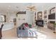 Open-concept living room with a fireplace, and view into the kitchen at 2046 Westover Reserve Blvd, Windermere, FL 34786