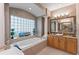 Luxurious bathroom featuring a large soaking tub, tiled surround and separate and vanities at 2046 Westover Reserve Blvd, Windermere, FL 34786