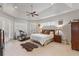 Spacious main bedroom with tray ceiling, plantation shutters, ensuite bath and workout equipment at 2046 Westover Reserve Blvd, Windermere, FL 34786