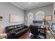 Comfortable office space with dark wood floors, built-in shelving, and two large windows at 2046 Westover Reserve Blvd, Windermere, FL 34786