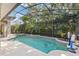 A screened-in pool and landscaped backyard create a private oasis at 2046 Westover Reserve Blvd, Windermere, FL 34786