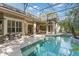 A screened-in pool with a covered patio for outdoor lounging and entertaining at 2046 Westover Reserve Blvd, Windermere, FL 34786