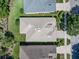 Overhead aerial view showing the home's roof, landscaping, and proximity to neighboring houses at 210 Coleton Lane, Deland, FL 32724