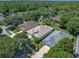 Aerial view of the property showcasing the home's placement and surrounding trees at 210 Coleton Lane, Deland, FL 32724