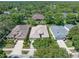 Aerial view of the property showcasing the home's placement and surrounding trees at 210 Coleton Lane, Deland, FL 32724