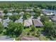 Aerial view highlighting the home, landscaping, and its location in a lush, green neighborhood at 210 Coleton Lane, Deland, FL 32724