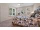 Bedroom with carpeted floors, a ceiling fan, two windows, and a queen bed at 210 Coleton Lane, Deland, FL 32724