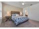 Bedroom with carpeted floors, a ceiling fan, and two windows at 210 Coleton Lane, Deland, FL 32724