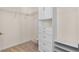 Walk-in closet with wire shelving and built-in storage drawers and cabinets at 210 Coleton Lane, Deland, FL 32724
