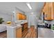 Well-equipped kitchen featuring wood cabinets, laminate countertops, and stainless steel appliances at 210 Coleton Lane, Deland, FL 32724