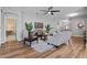 Comfortable living room with wood floors and a view of the entry and dining area at 210 Coleton Lane, Deland, FL 32724