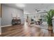 Open living room with wood floors, neutral paint, and plenty of natural light at 210 Coleton Lane, Deland, FL 32724