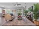Bright living room with wood flooring, comfortable seating, and large windows at 210 Coleton Lane, Deland, FL 32724