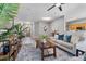 Open-concept living room with wood flooring, neutral decor, and an inviting atmosphere at 210 Coleton Lane, Deland, FL 32724