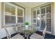 Covered patio featuring a glass-topped table and four chairs at 210 Coleton Lane, Deland, FL 32724