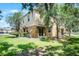 Backyard exterior featuring a well-maintained lawn and landscaping at 2193 Betsy Ross Ln, St Cloud, FL 34769