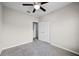 Neutral bedroom with ceiling fan, closet, and carpeted flooring for comfort at 2193 Betsy Ross Ln, St Cloud, FL 34769