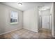 Neutral bedroom featuring tile floors, a window with blinds, and a closet at 2193 Betsy Ross Ln, St Cloud, FL 34769