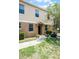 Attractive two-story townhouse showing the front entrance, landscaping, and sidewalk at 2193 Betsy Ross Ln, St Cloud, FL 34769