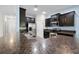 Modern kitchen with dark cabinets, stainless appliances, and a countertop island at 2193 Betsy Ross Ln, St Cloud, FL 34769