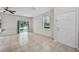 Bright living room boasting neutral walls, tile floors and a sliding glass door at 2193 Betsy Ross Ln, St Cloud, FL 34769