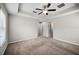 Spacious main bedroom boasts soft carpet and recessed lighting, complemented by multiple entryways at 2193 Betsy Ross Ln, St Cloud, FL 34769