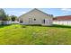Exterior rear view of home showcasing large backyard with fence at 2301 Finwick Ct, Kissimmee, FL 34743