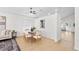 Bright dining room with modern lighting, beautiful floors, and access to living area at 2301 Finwick Ct, Kissimmee, FL 34743