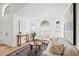 Bright living room featuring arched windows, neutral colors, and elegant furnishings at 2301 Finwick Ct, Kissimmee, FL 34743