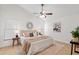 Spacious main bedroom with a ceiling fan, neutral decor, and ample natural light at 2301 Finwick Ct, Kissimmee, FL 34743