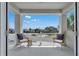 Relaxing balcony featuring comfortable seating and a view of the neighborhood at 2845 High Pointe St, Clermont, FL 34711