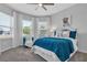 Bright bedroom with large windows, a cozy chair, and a comfortable bed at 2845 High Pointe St, Clermont, FL 34711