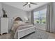 Neutral bedroom showcasing a queen bed, large windows and light colored walls at 2845 High Pointe St, Clermont, FL 34711